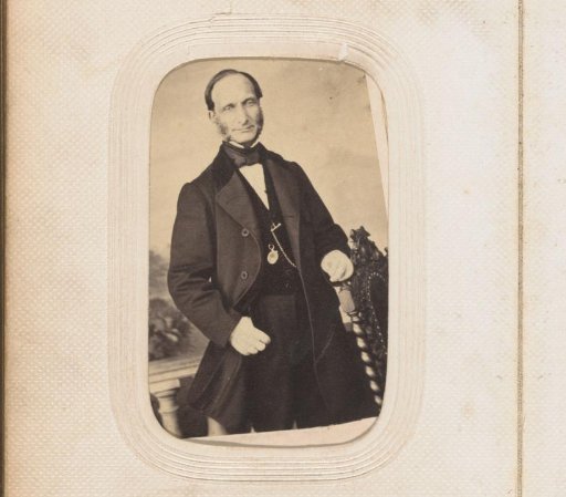 Portrait of a standing man with sideburns