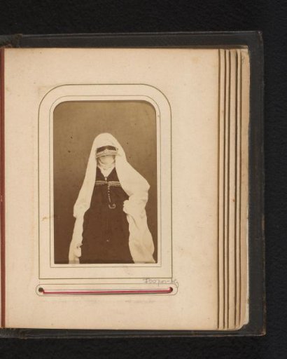 Portrait of a woman in fully covering clothing, presumably from the Balkans