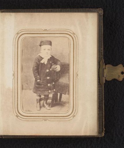 Portrait of a Standing Child with a Cap