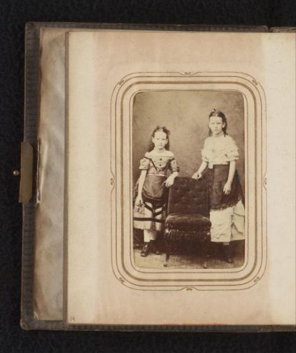 Portrait of Two Girls by a Chair