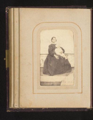 Portrait of a seated mother with child