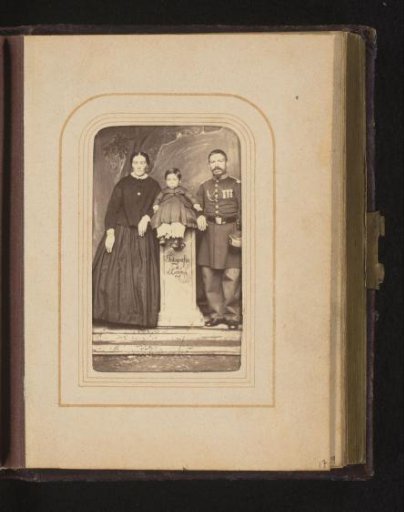 Family portrait with a man in uniform, a woman and a child