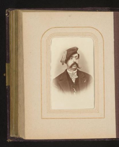 Portrait of a man with a mustache and cap
