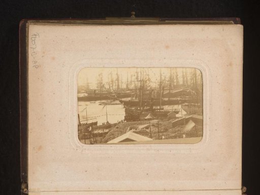 View of a quay with ships with flags
