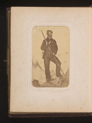 Photographic reproduction of a man on the top of a mountain