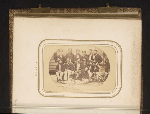 Group portrait of crew members on board a ship