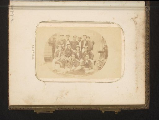 Group portrait of crew members on board a ship
