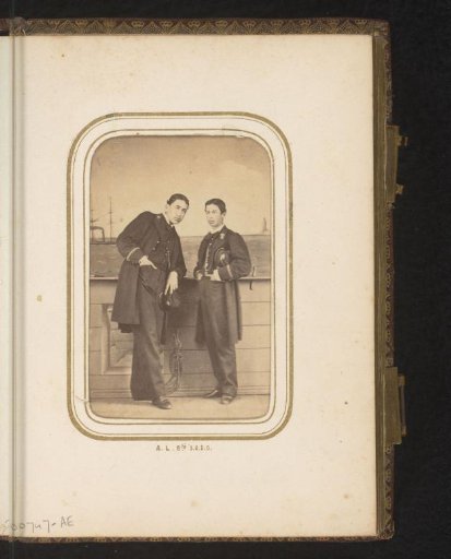 Portrait of two standing young men in uniform