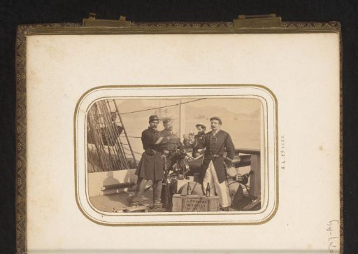 Crew members on board a ship, raising a glass