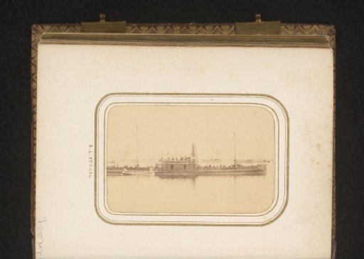 Crew members on a ship in a harbour