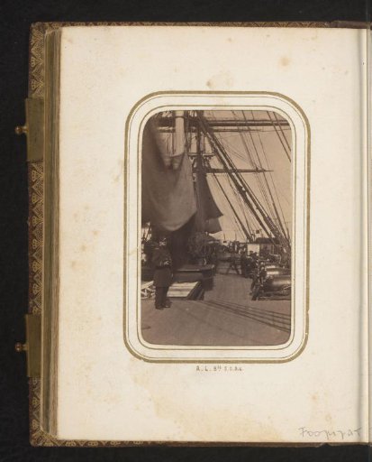 Captain with telescope and crew on the deck of a ship