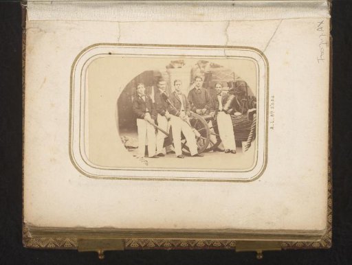Group portrait of men in uniform on board a ship