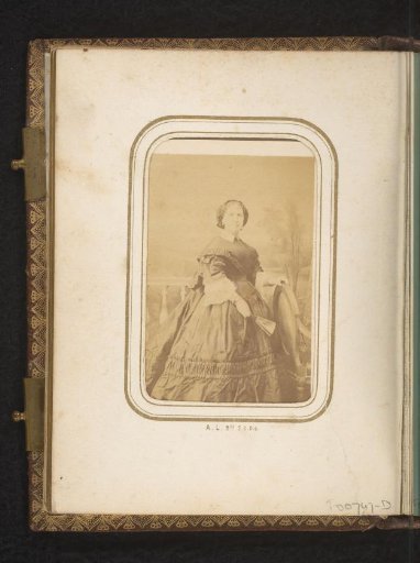 Portrait of a standing woman with a fan