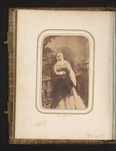 Portrait of Carmen Paz in habit before a backdrop