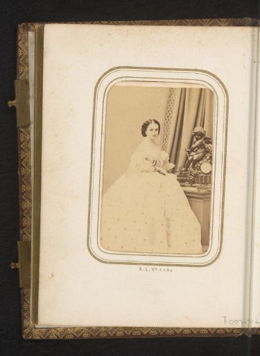 Portrait of a standing woman by a clock