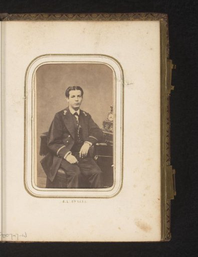 Portrait of a seated young man in uniform