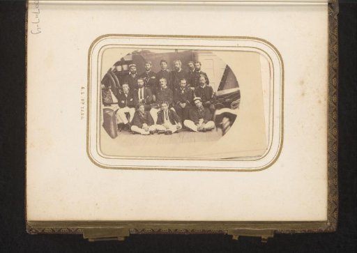 Group portrait of crew members of a ship on deck