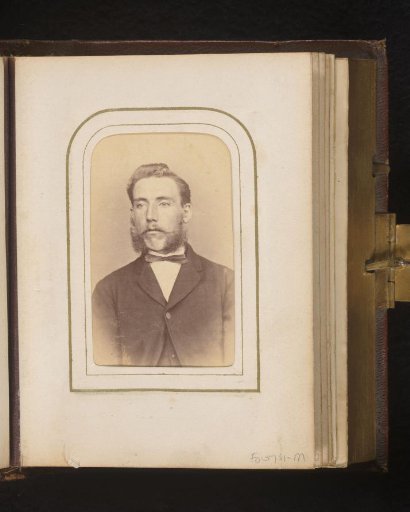 Portrait of a man with sideburns and a moustache