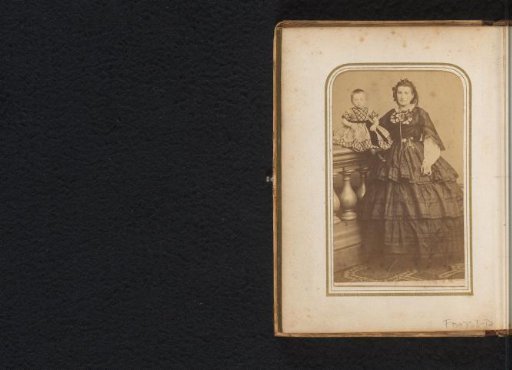 Portrait of a standing woman with a child on a balustrade