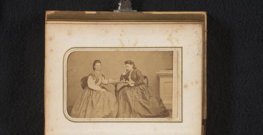 Portrait of two women playing chess