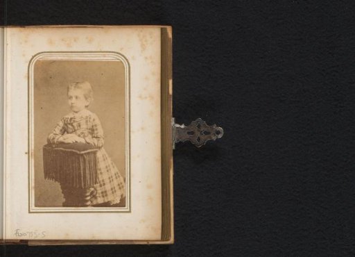 Portrait of a kneeling girl on a prayer stool