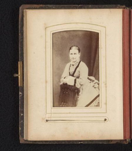 Portrait of a woman leaning on a chair