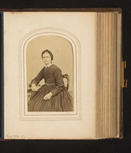 Portrait of a seated woman with cap
