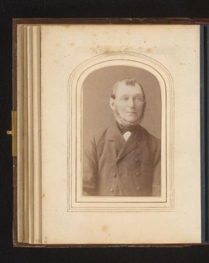 Portrait of a man with a beard ring