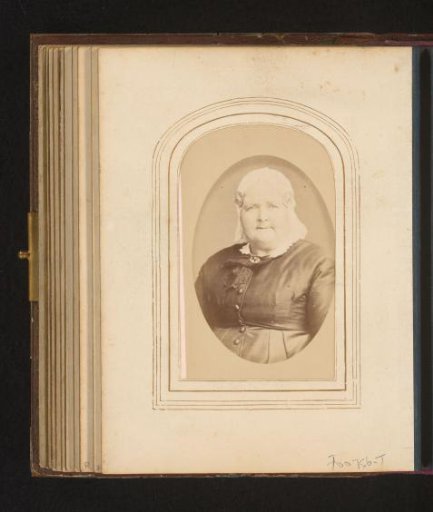 Portrait of a woman with a white traditional cap