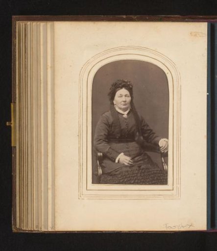 Portrait of a seated woman with cap