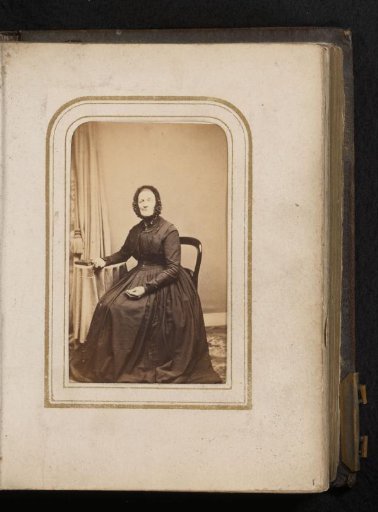 Portrait of a Woman with a Cap, Seated at a Table