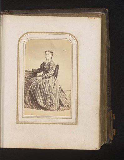 Portrait of a Woman Seated at a Table