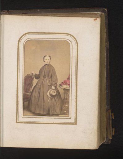 Portrait of a Woman with a Hat in Her Hand, Standing by a Chair