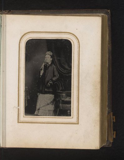 Portrait of a Woman Standing by a Chair