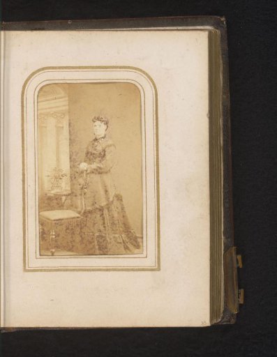 Portrait of a Woman Standing by a Chair