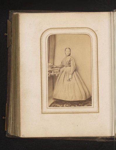 Portrait of a Woman with Flowers in Her Hand, Standing by a High Table