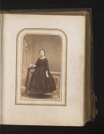 Portrait of a Girl Standing by a Prayer Desk