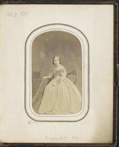 Portrait of a woman at a table, inscribed E.K.