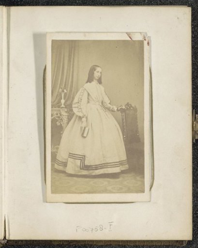 Portrait of a woman with a book in her hand by a table, inscribed Jane Kettle