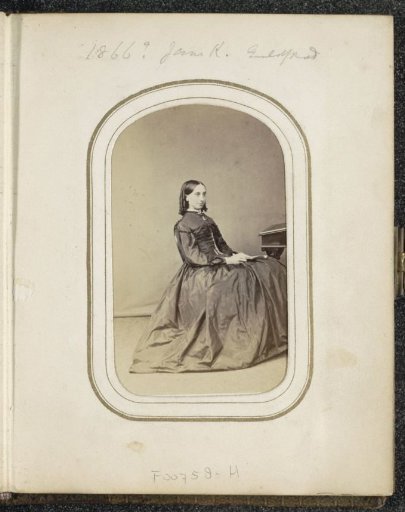 Portrait of a woman with a book seated at a desk, inscribed Jane K.