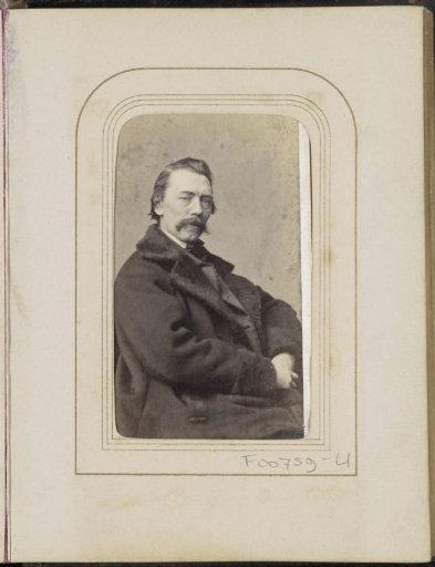 Portrait of a man with a moustache in a winter coat