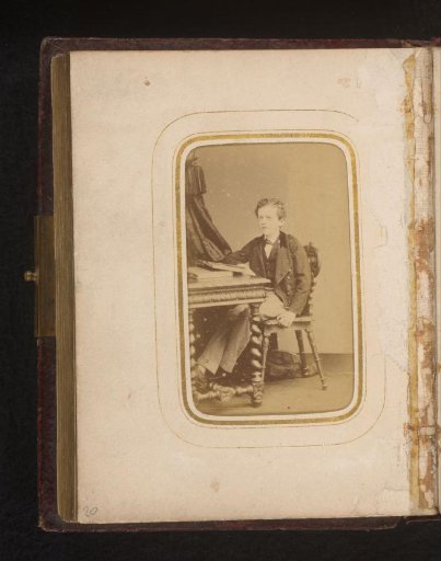 Portrait of a boy, sitting at a desk