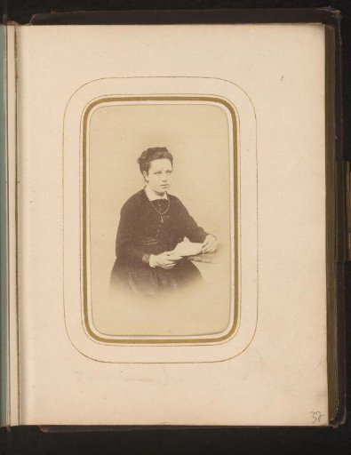 Portrait of a seated woman with a book