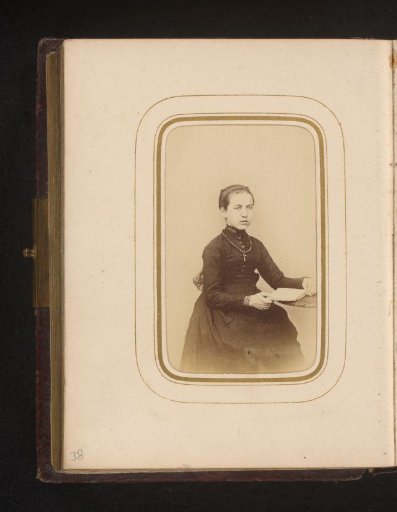 Portrait of a seated woman with a book