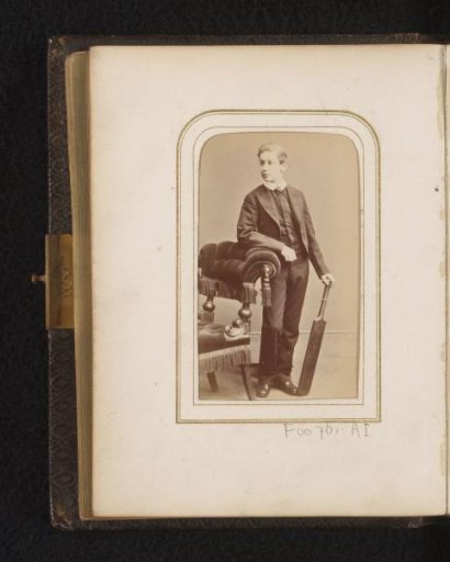 Portrait of a boy with a cricket bat