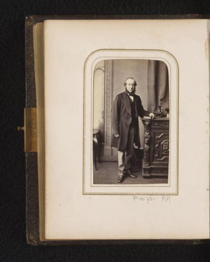 Portrait of a standing man with sideburns