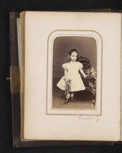 Portrait of a girl with a doll