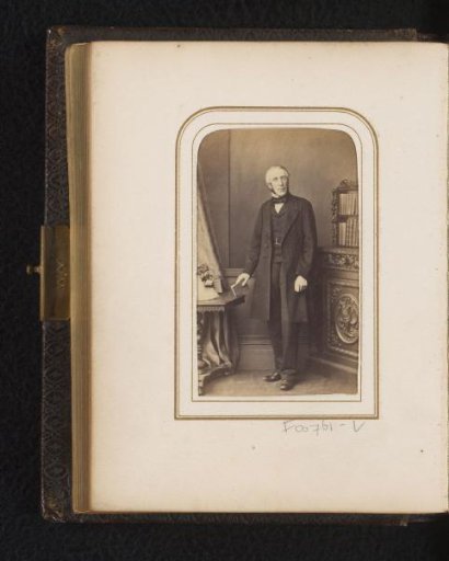 Portrait of a standing man with a book