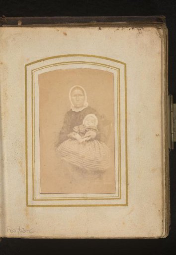 Portrait of a woman with a cap according to Overijssel costume, with a baby on her lap