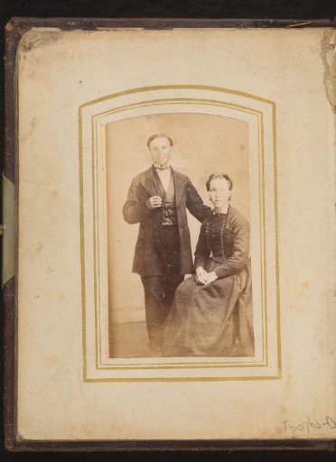 Portrait of a seated woman and a standing man
